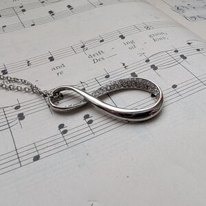 Polished Silver Infinity Pendant Necklace with Crystal Accents